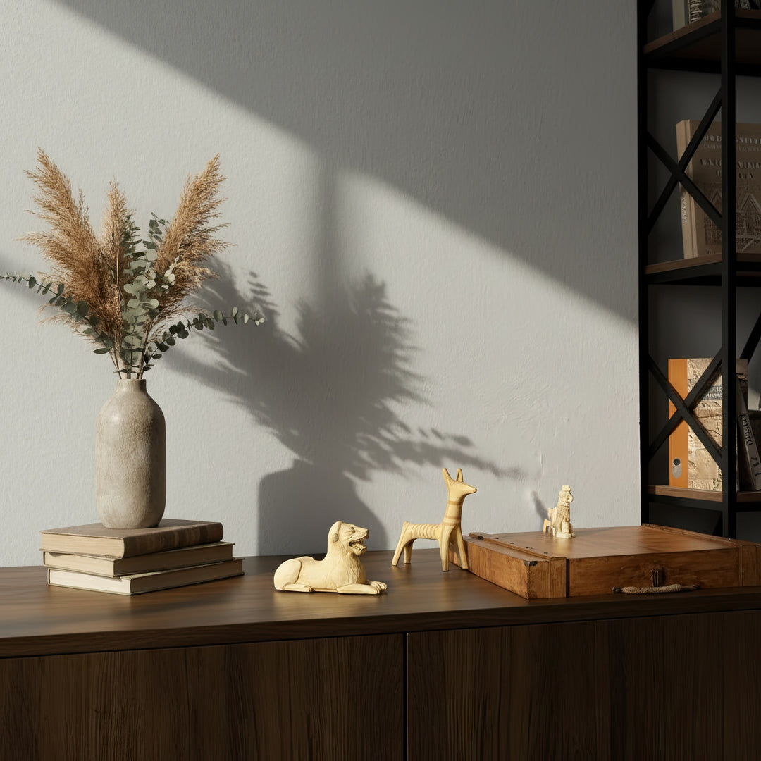 Ancient Animal Guardian Set displayed on a wooden table in a boho-style interior — four handmade animal totem sculptures arranged with warm lighting, symbolizing harmony between nature and ancient civilizations.
