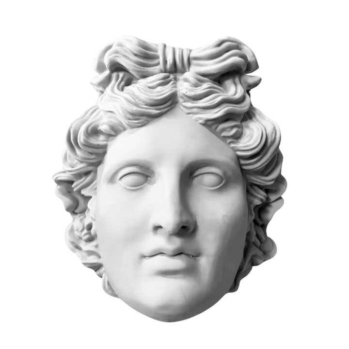 “Handcrafted Apollo wall bust displayed on a neutral background, highlighting its refined classical features and marble-like texture. Inspired by ancient Greek sculpture, this museum-quality piece brings divine elegance to modern interiors.”
TR:
“Nötr bir arka planda sergilenen el yapımı Apollo duvar büstü — zarif klasik hatları ve mermer benzeri dokusuyla öne çıkıyor. Antik Yunan heykellerinden esinlenen bu müze kalitesindeki eser, modern iç mekanlara tanrısal bir zarafet katar.”