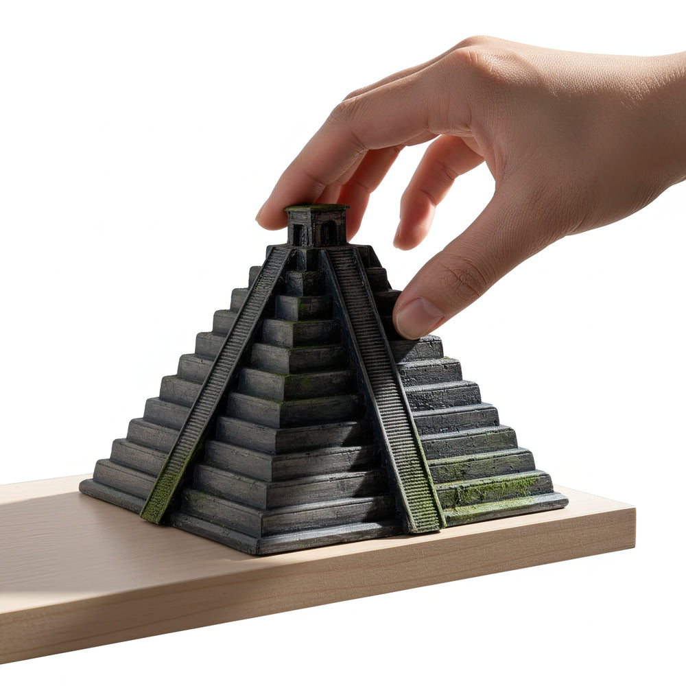 “Hand placing the handmade Chichen Itza Pyramid replica on a wooden shelf — a detailed archaeological decor piece reflecting ancient Mayan craftsmanship and sacred temple design.”
TR:
“Elin, el yapımı Chichen Itza Piramidi replikasını ahşap bir rafa yerleştirdiği görsel — antik Maya el işçiliğini ve kutsal tapınak mimarisini yansıtan detaylı bir arkeolojik dekor objesi.”
