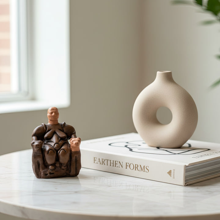 “Kibele Goddess Statue placed on a wooden shelf beside books and dried herbs — evoking ancient wisdom and earthy calm.”
TR:
“Kitaplar ve kuru otlarla birlikte ahşap bir rafta sergilenen Kibele Tanrıça heykeli; antik bilgeliği ve toprak tonlarındaki huzuru çağrıştırıyor.”